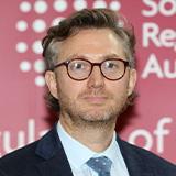 Close up image of Richard Williams speaking at an event