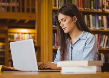 Woman looking at laptop